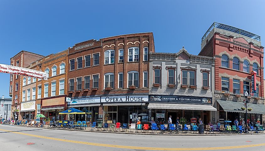 The Historic Building along Main Street, with locals and tourist walking along, waiting for the parade in Buckhannon, West Virginia, via Roberto Galan / Shutterstock.com