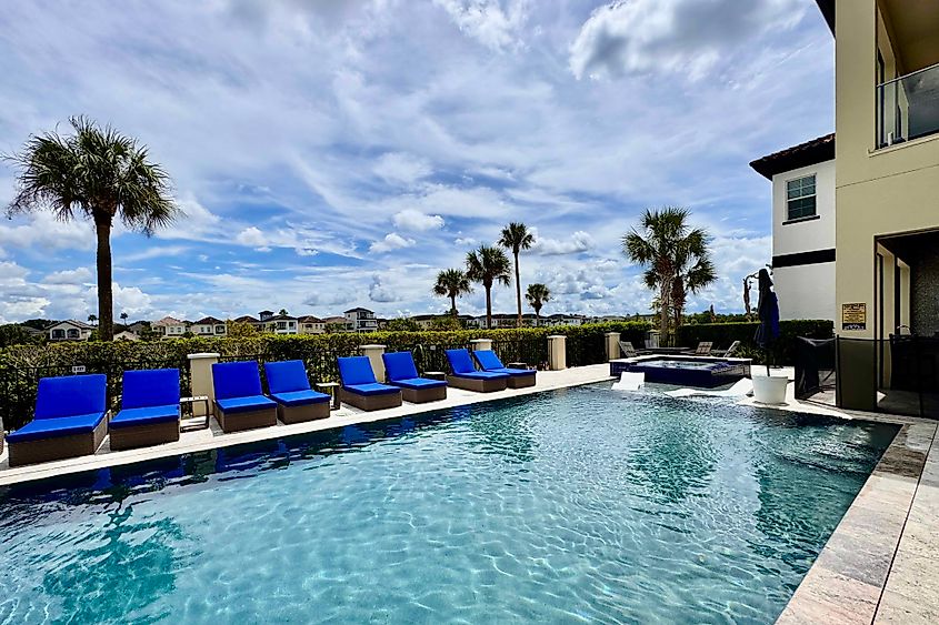 A golf-side swimming pool and hot tub at a Kissimmee rental home.