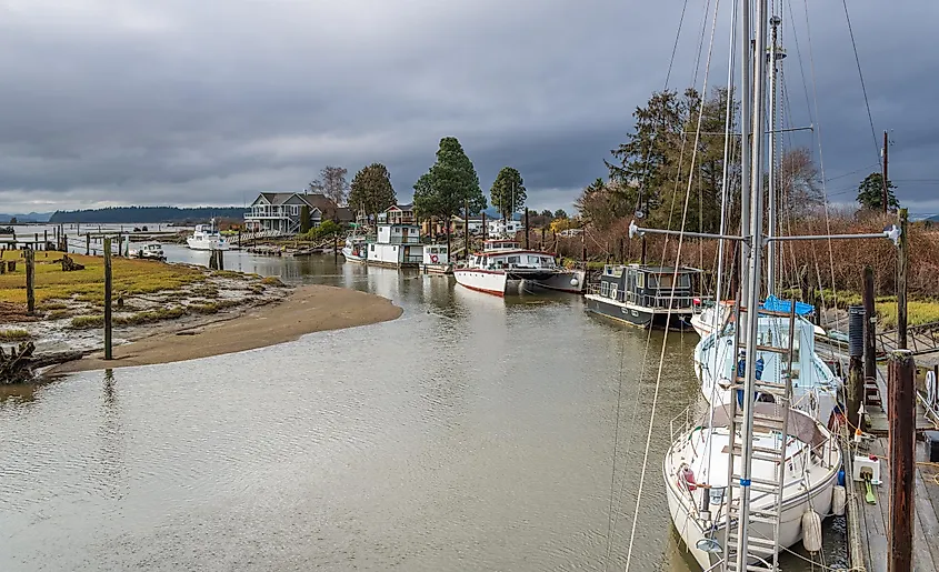Boats along Samish River entering Samish Bay, Edison, Washington, USA.