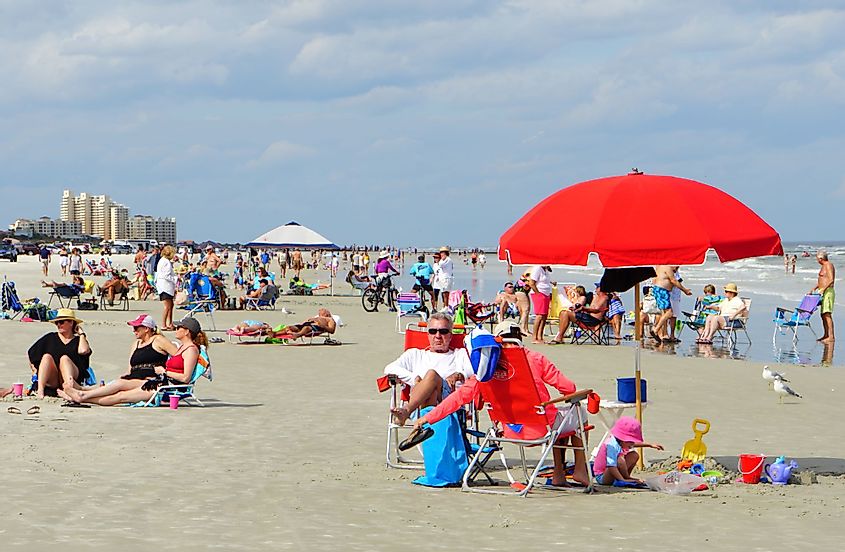 People enjoying on the beach in New Smyrna Beach, Florida