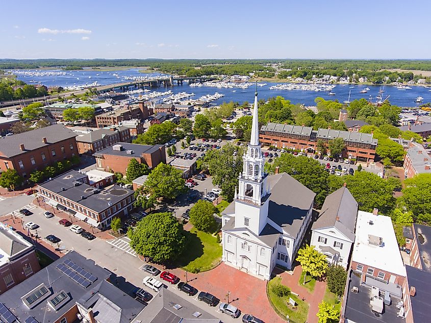 Newburyport historic downtown including State Street and First Religious Society Unitarian Universalist Church with Merrimack River at the background