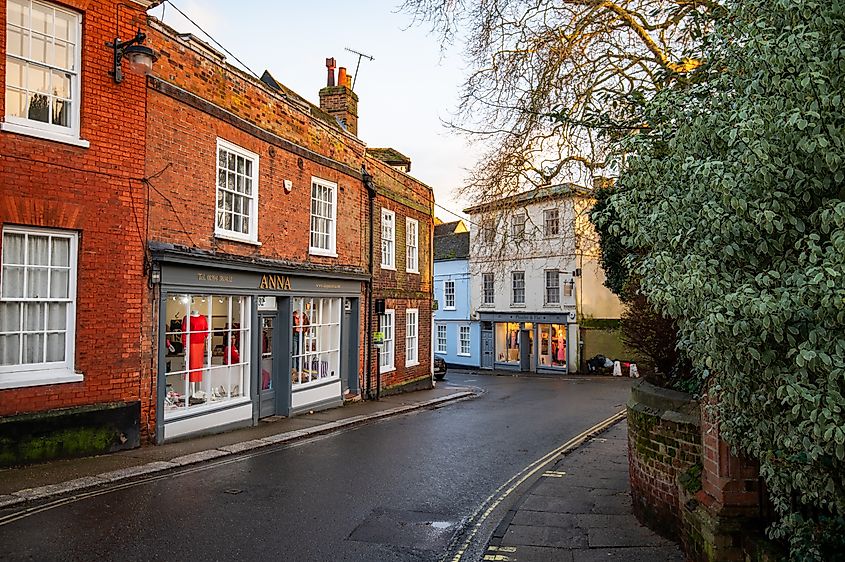 Historic Georgian houses lining the streets in Woodbridge, England on a sunny day. 