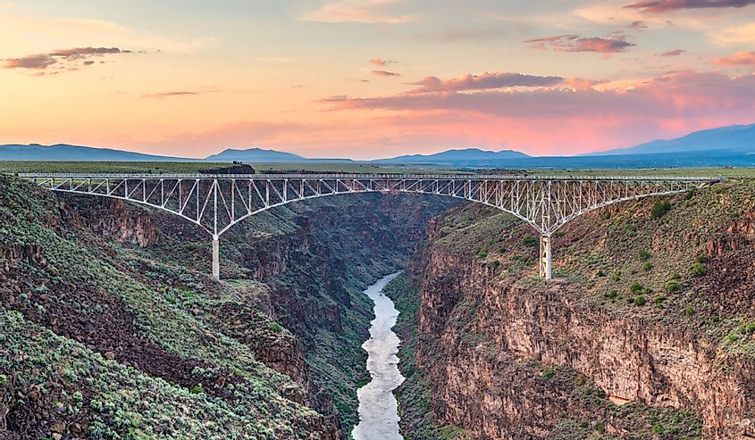 Taos, New Mexico, USA at Rio Grande Gorge Bridge over the Rio Grande at dusk