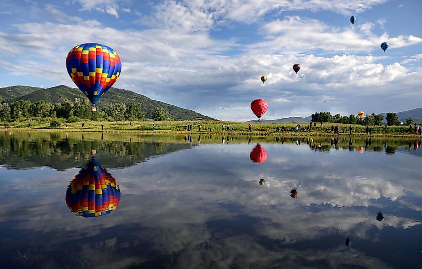 Balloons float over Bald Eagle Lake during the 38th annual Steamboat Springs, via Rhona Wise / Shutterstock.com