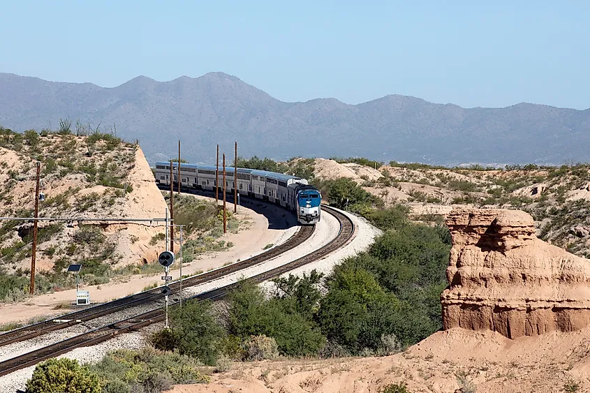 An Amtrak train travels through the desert in Benson, Arizona.