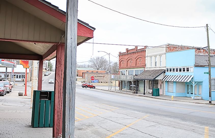 Colorful buildings and houses in Granby, Missouri, on a cloudy winter day, with overcast skies and muted natural tones in the surroundings.