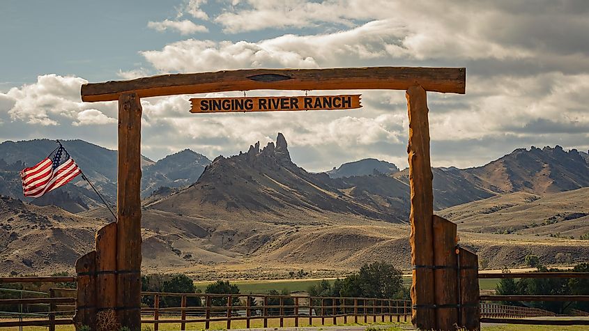 Entrance to a ranch in Cody, Wyoming, USA, with a beautiful mountain range in the background.