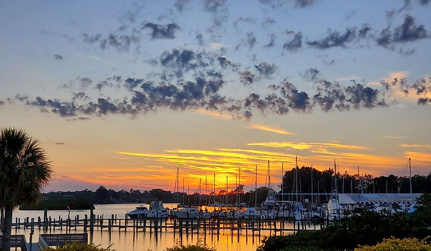 Sunset over boats and water Tarpon Springs, Florida.