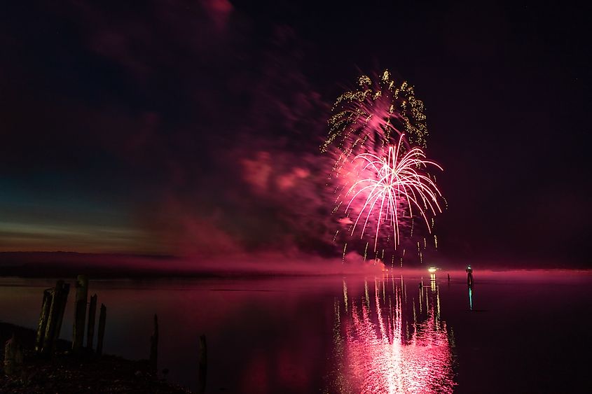 Fireworks over the Coquille River in Bandon Oregon, 4th of July holiday celebration.
