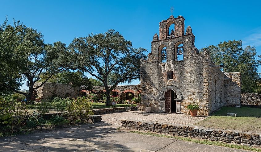 Mission Espada Church surrounded by trees