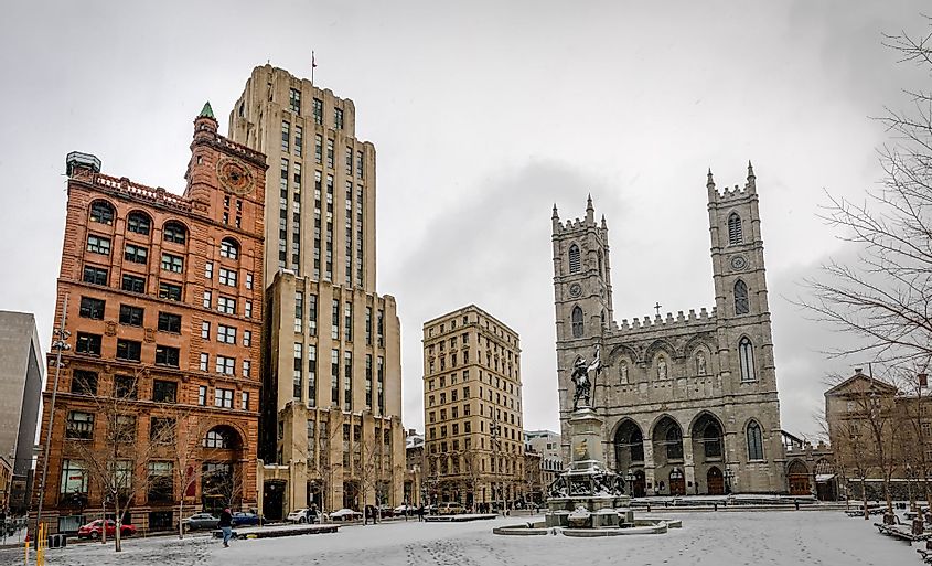 A view of Basilica of Notre-Dame of Montreal and Place d'Armes during winter in Montreal, Canada