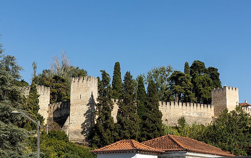 Castle of Torres Novas. Made of granite blocks, sunny day with blue sky. Via Shutterstock / PixelBiss