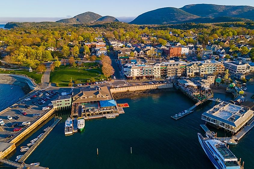 Bar Harbor historic town center aerial view at sunset, with Cadillac Mountain in Acadia National Park at the background, Bar Harbor, Maine