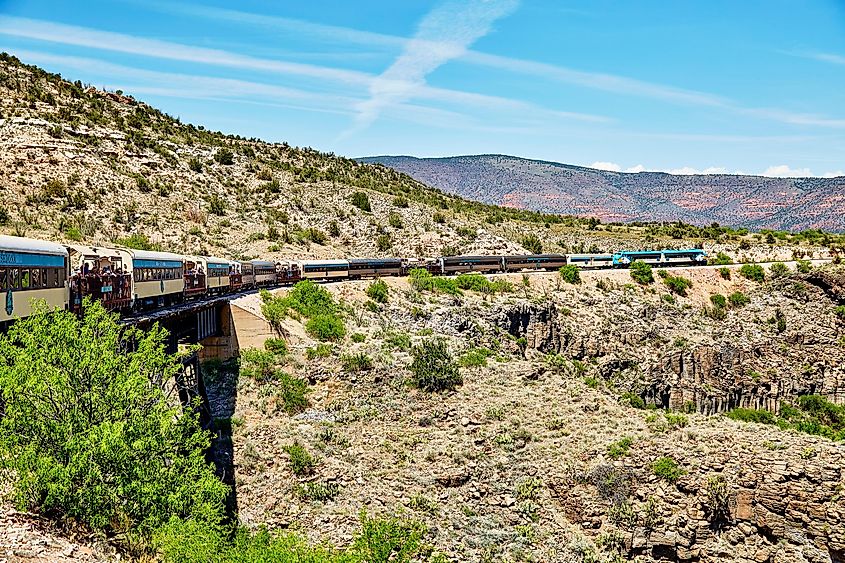 Verde Canyon Railroad train crossing bridge in Clarkdale, Arizona.