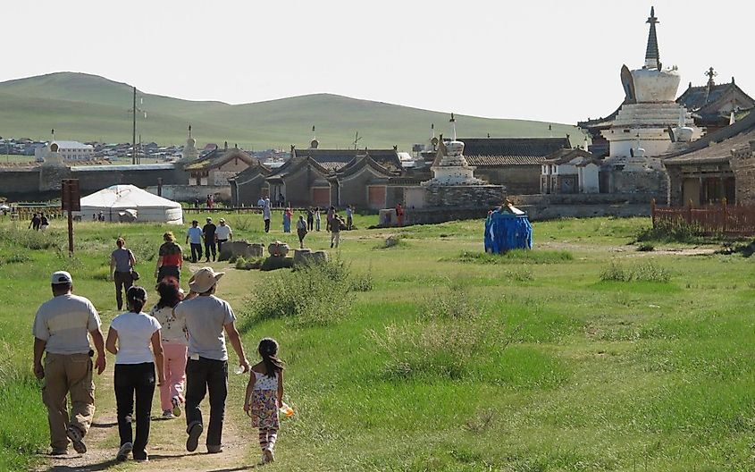 Kharkhorin aka Karakorum, Mongolia 17th August 2011 - groups of tourists walking towards the ruins of what was the capital of the Mongol Empire from 1235 to 1263