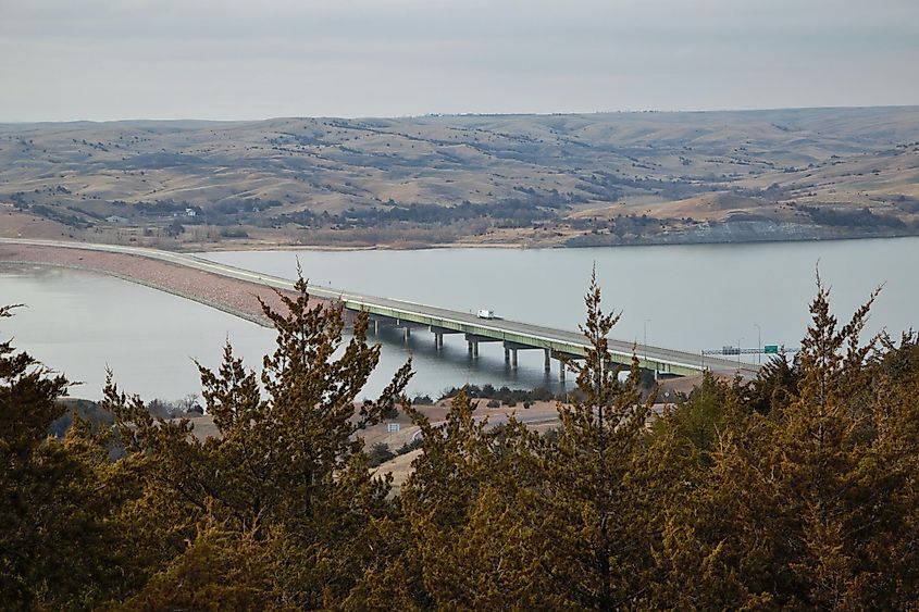 Truck driving over the Missouri River in South Dakota on a long bridge.