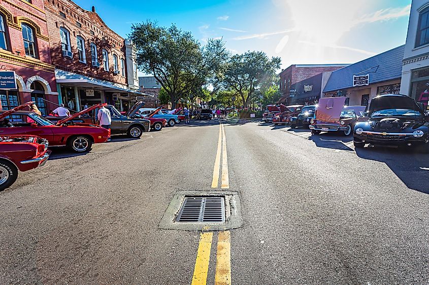 Wide angle view of a classic car show taking place on a downtown street in Fernandina Beach, Florid