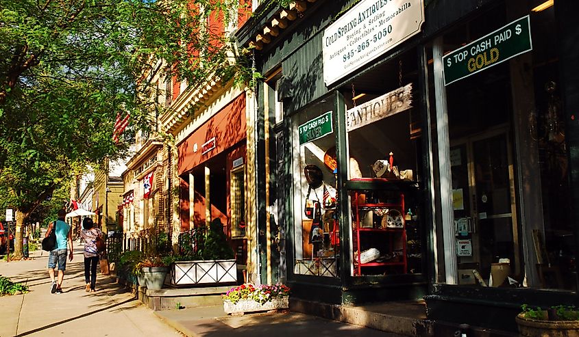 People walk along the main shopping district of Cold Spring, New York. 