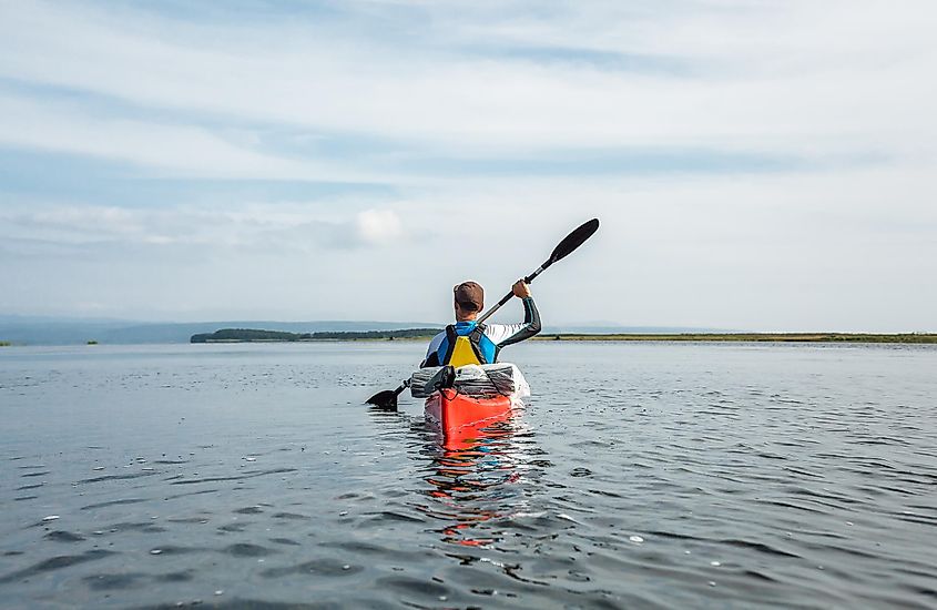 Kayaker on Lake Busse, Sakhalin Island.