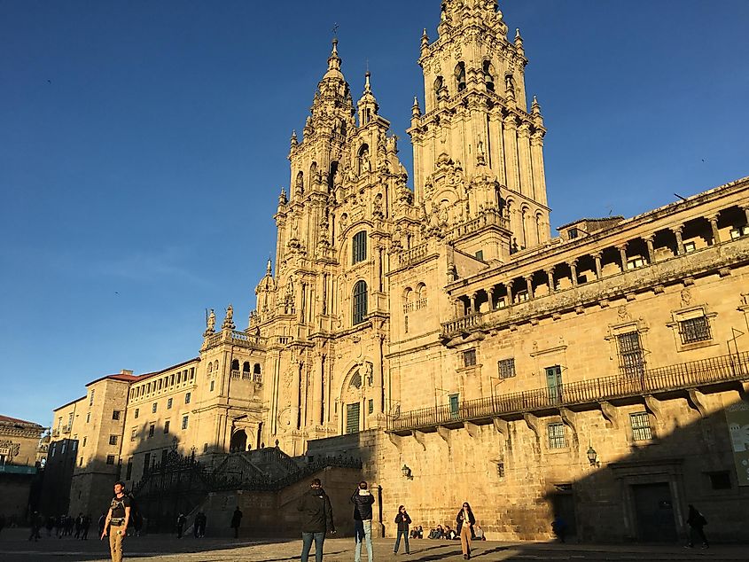 The late afternoon sun strikes the massive, 12th-century Santiago de Compostela Cathedral. 