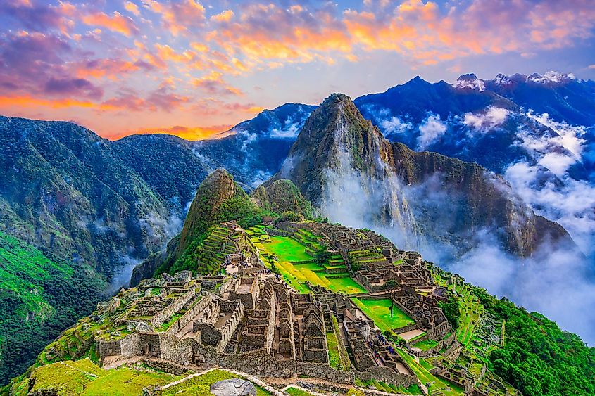 Machu Picchu, an ancient stone city, with blue sky and clouds overhead