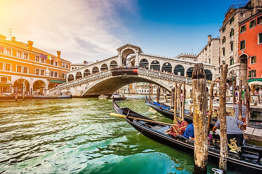 Panoramic view of famous Canal Grande from famous Rialto Bridge at sunset in Venice, Italy