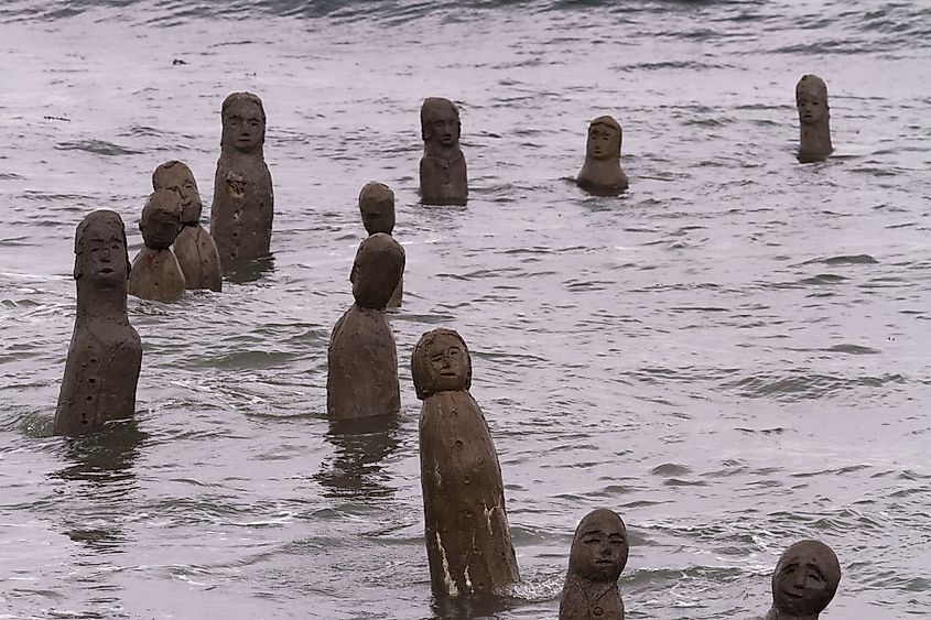 Sainte-Flavie, Quebec Canada - June 27 2020: in 1986, this evolving masterpiece features over 100 life-sized sculptures that appear to emerge from the St. Lawrence River, creating a dynamic scene