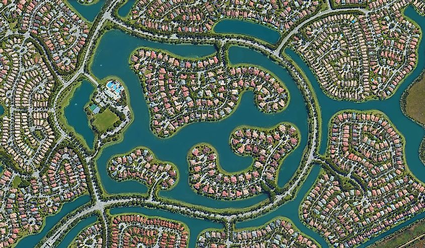 Weston, Florida, settlement of the wealthy district with water channels, looking down aerial view from above, bird’s eye view Florid