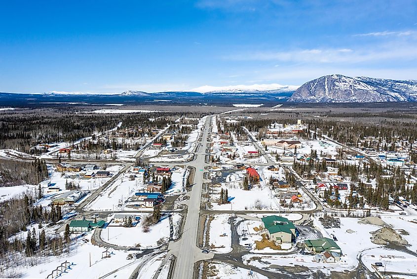 South to North view of the main street in Haines Junction in the Yukon taken from a drone on a sunny day in spring.