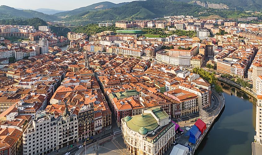 Aerial view of the Bilbao old town, Basque country, Spain. Casco Viejo de Bilbao with red tiled rooftops and historic seven streets in Bilbao city.