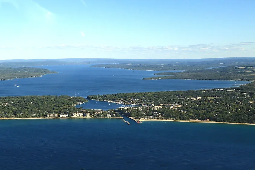 Charlevoix, Michigan, uniquely situated between Lake Michigan and Lake Charlevoix, with Round Lake in the middle.