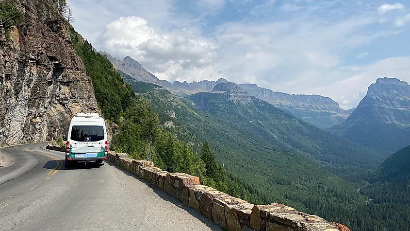A Glacier National Park shuttle leads the way up through the park's mountain scenery via the Going-to-the-Sun Road.