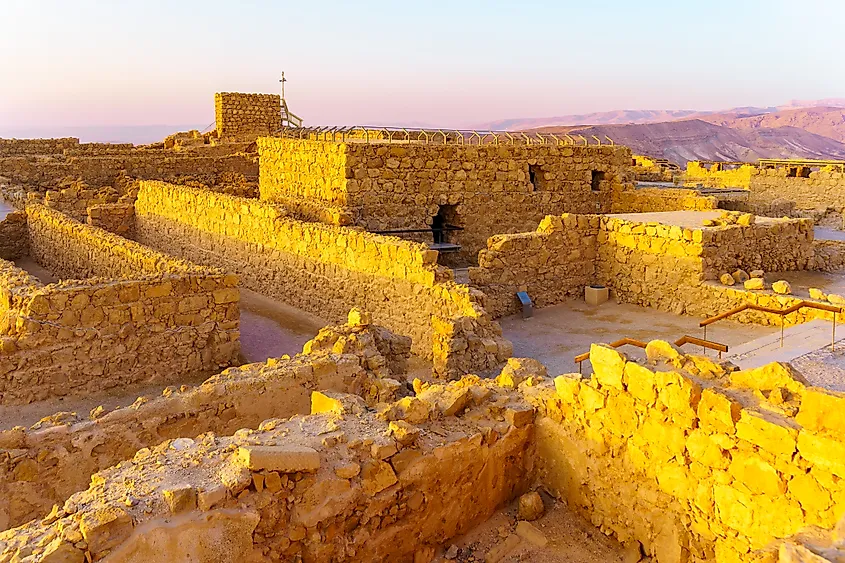 Sunrise view of the ancient ruins of the Masada Fortress, Dead Sea coast, Judaean Desert, southern Israel