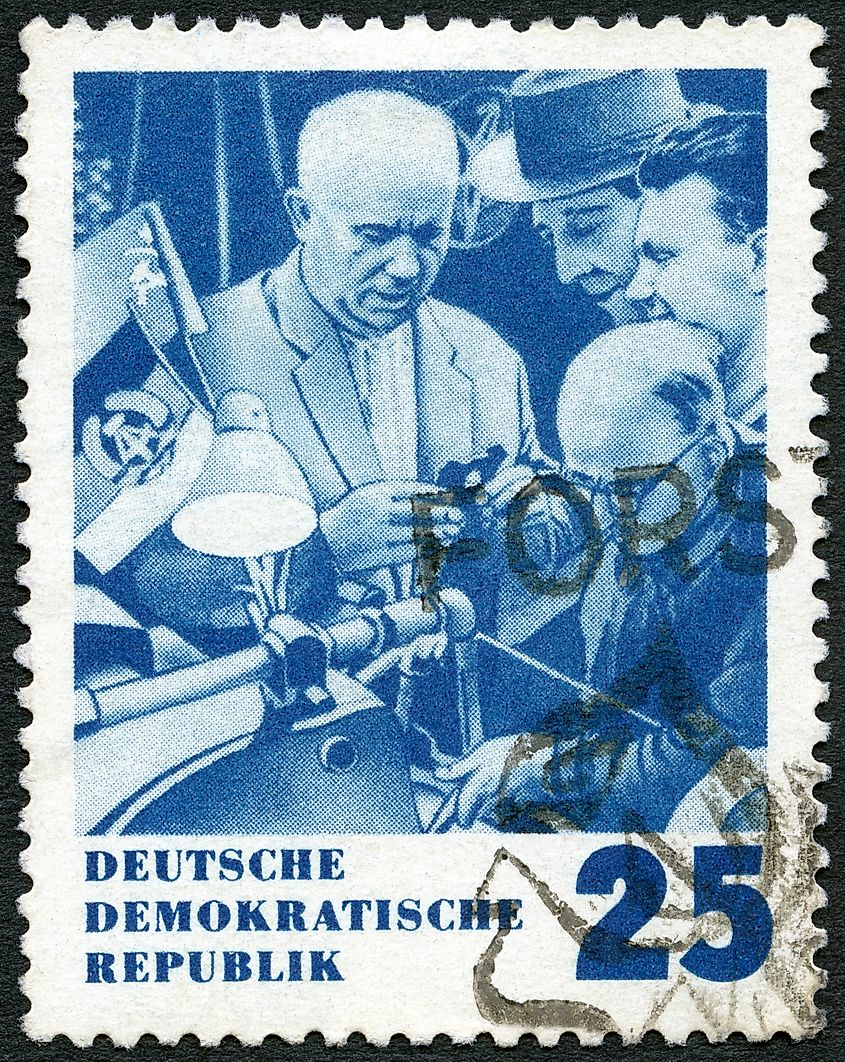 A stamp printed in Germany shows Khrushchev and Inventors, Issued in honor of Premier Nikita S. Khrushchev of the Soviet Union, circa 1964 Editorial credit: Olga Popova / Shutterstock.com