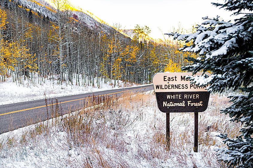 Maroon Bells sign for wilderness portal and white river national forest in Aspen, Colorado 