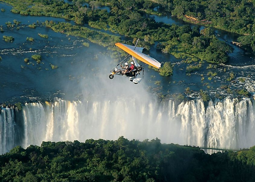 Tourists fly over the Victoria Falls