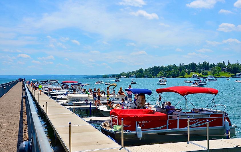 Pier with luxury boats docked in Skaneateles Lake. Editorial credit: PQK / Shutterstock.com.