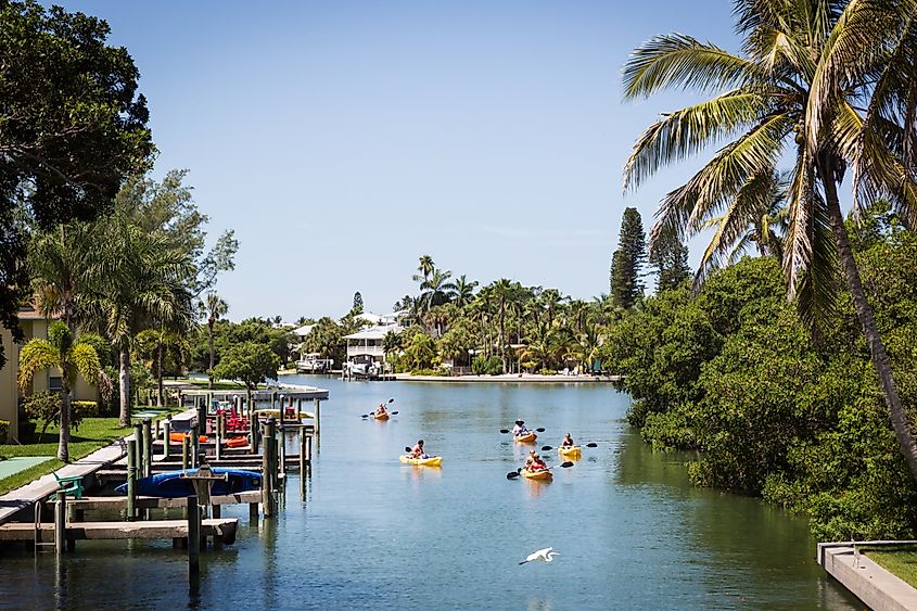 Kayakers floating in a canal on Anna Maria Island, Florida