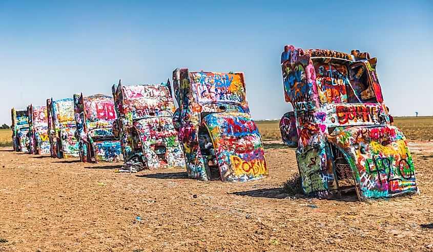 Cadillac Ranch, located along I-40, is a public art sculpture of antique Cadillacs buried nose-down in a field.