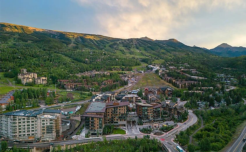 Aerial view of Snowmass in Colorado, via Snowmass Village Hotels, Lodging & Resorts | Snowmass Village (aspensnowmass.com)