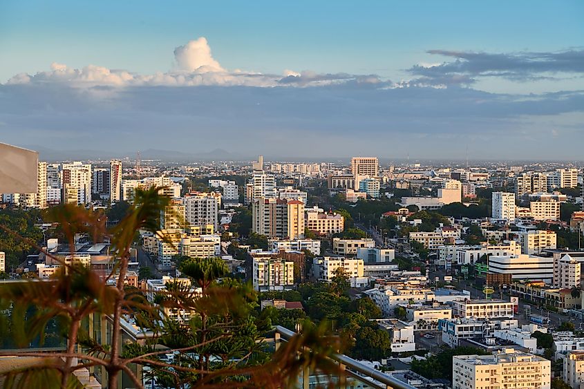 A roof top view of a beautiful sunset during golden hour over the city of Santo Dominigo.