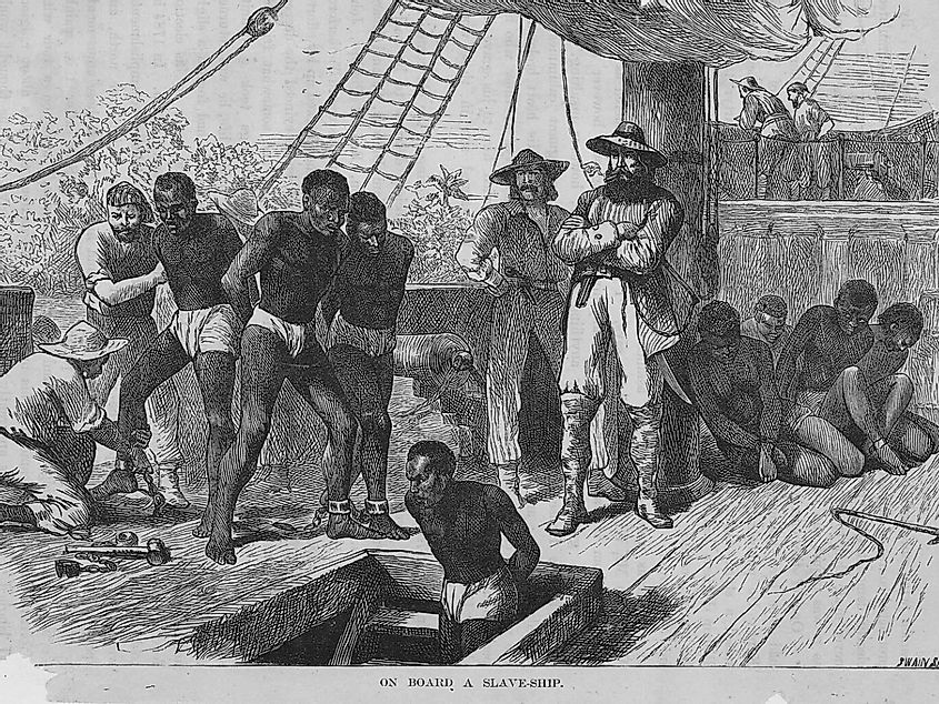 Slaves aboard a slave ship being shackled before being put in the hold, 1835