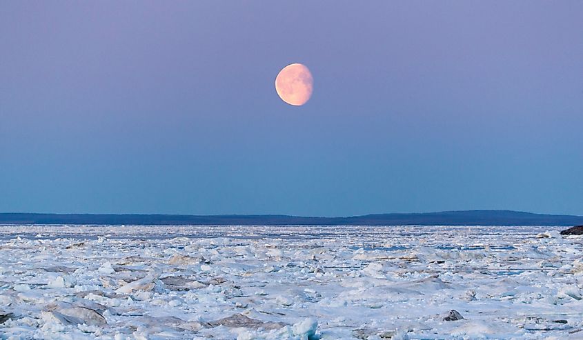 Moonrise above drifting sea ice along Frozen Strait in northern Hudson Bay near Arctic Circle