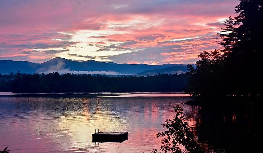 Pink August sunset over Kezar Lake in Lovell, Maine