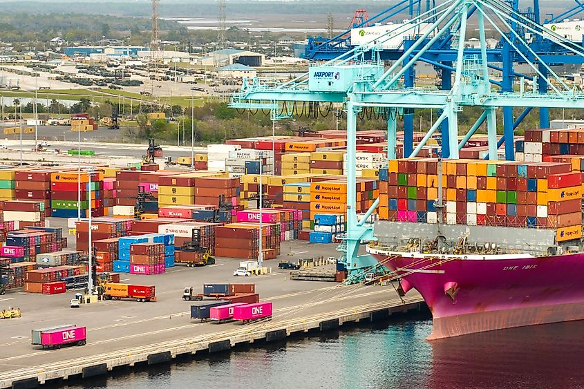 Loading container ship in port of Savannah, Georgia. Editorial credit: Bilanol / Shutterstock.com