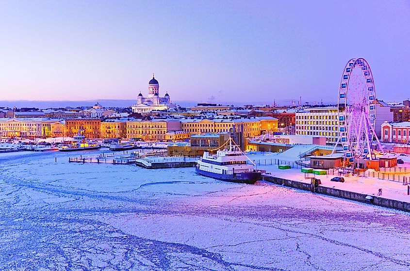 View of the icy harbor at dusk in winter in Helsinki.