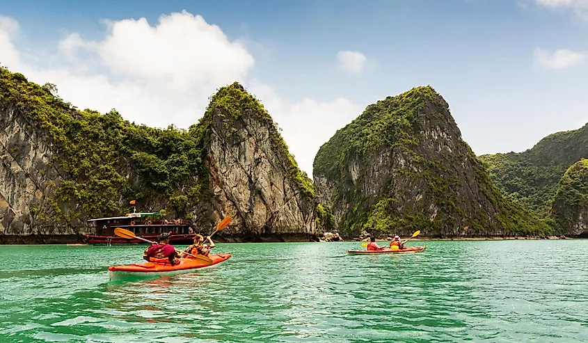 Two kayaks paddling in Halong Bay, Vietnam.
