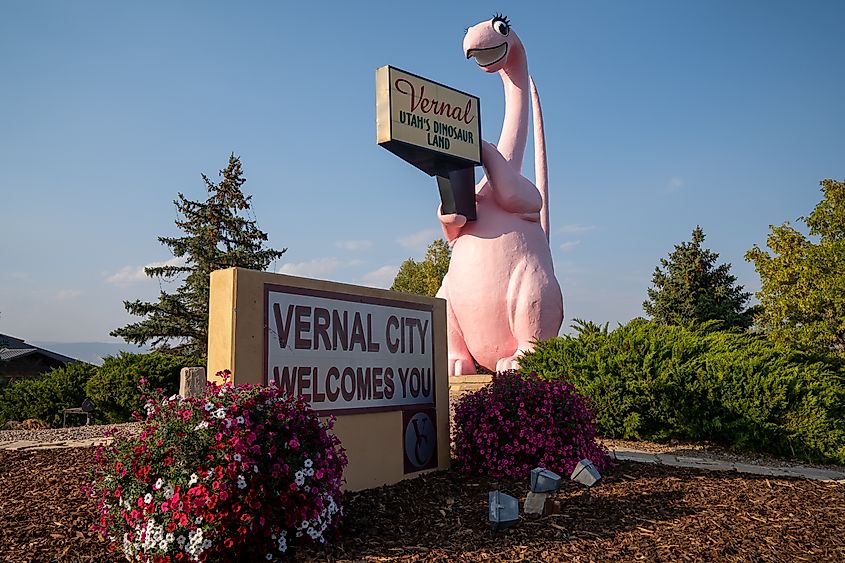 Sign for Vernal Utah, with its famous pink dinosaur statue. Editorial credit: melissamn / Shutterstock.com