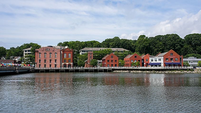 Red brick buildings near Saugatuck River with bridge near downtown in nice day