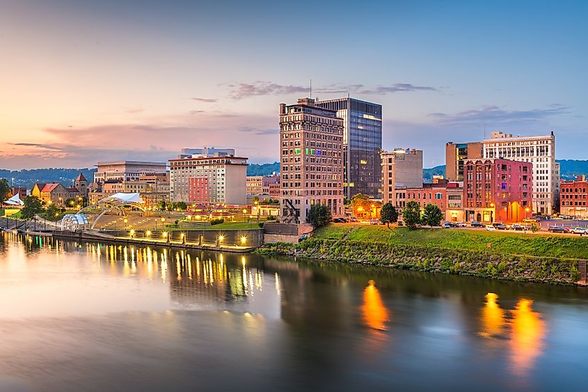 Charleston, West Virginia, USA downtown skyline on the river at dusk.